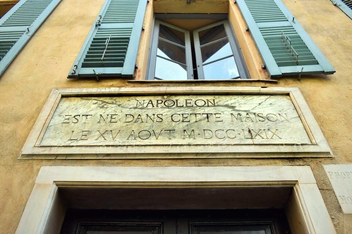 The carved plaque above the door of the Maison Bonaparte, saying Napoleon was born in this house on 15 August 1769