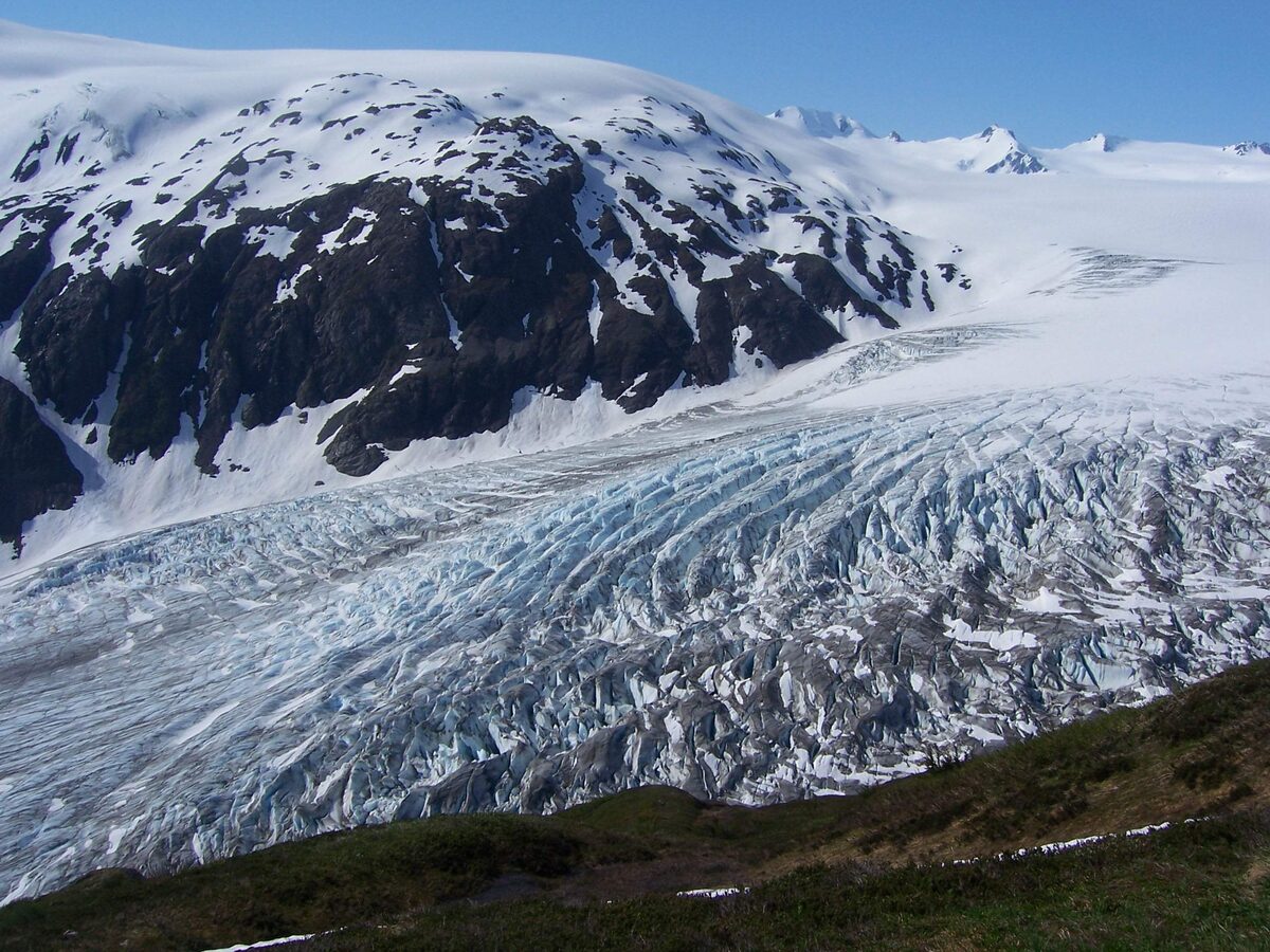 Exit Glacier seen from the Harding Icefield Trail, with snow-streaked mountains above the crevassed ice