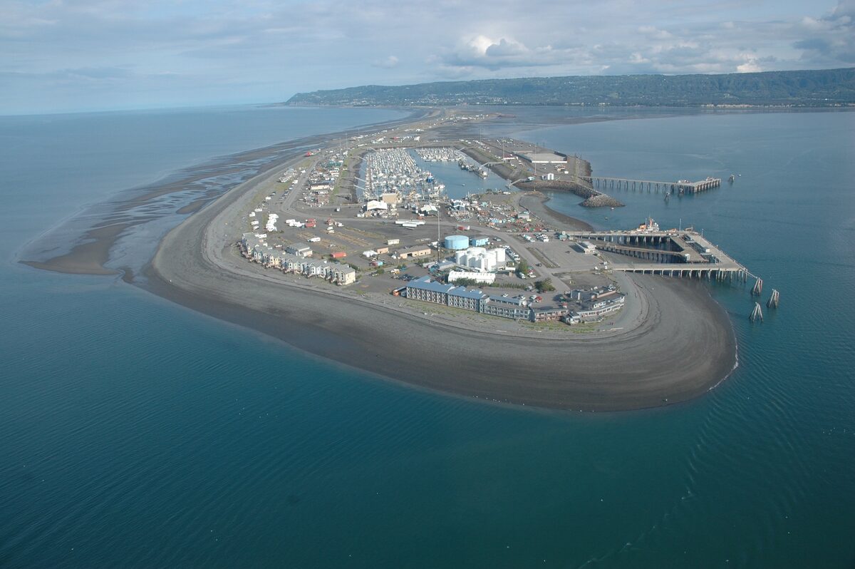 Aerial view of the Homer Spit, a gravel bar reaching into Kachemak Bay with the harbor and shops on its tip
