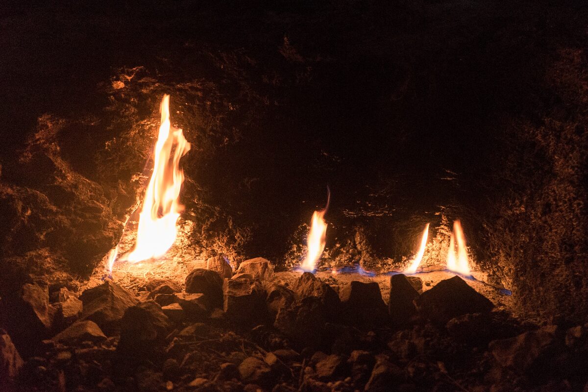 Natural gas flames burning out of the rocky ground at Yanartaş at night