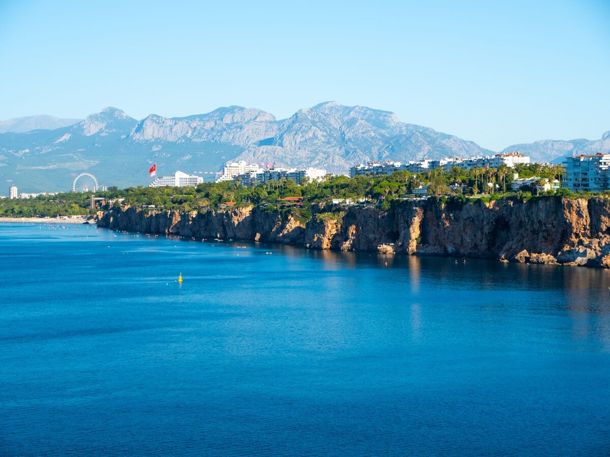 The sheer limestone cliffs along Antalya's seafront, with the Taurus Mountains across the bay