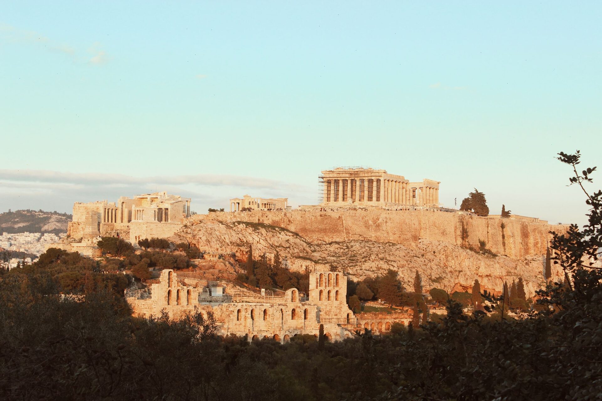 The Acropolis in warm late-afternoon light, with the Propylaea, the Erechtheion and the Parthenon above the Odeon of Herodes Atticus