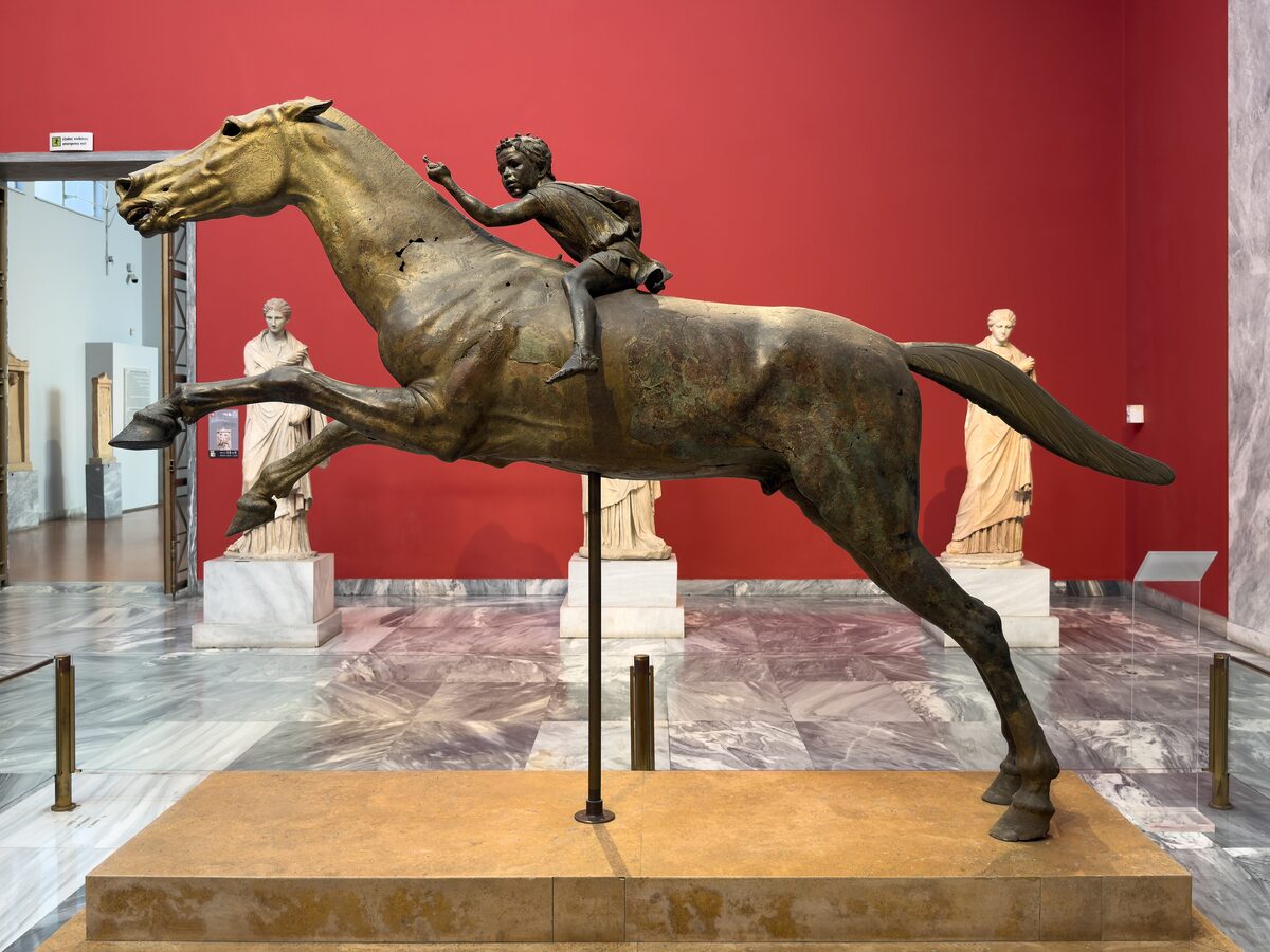The bronze Jockey of Artemision, a galloping horse with a small boy rider, in the National Archaeological Museum