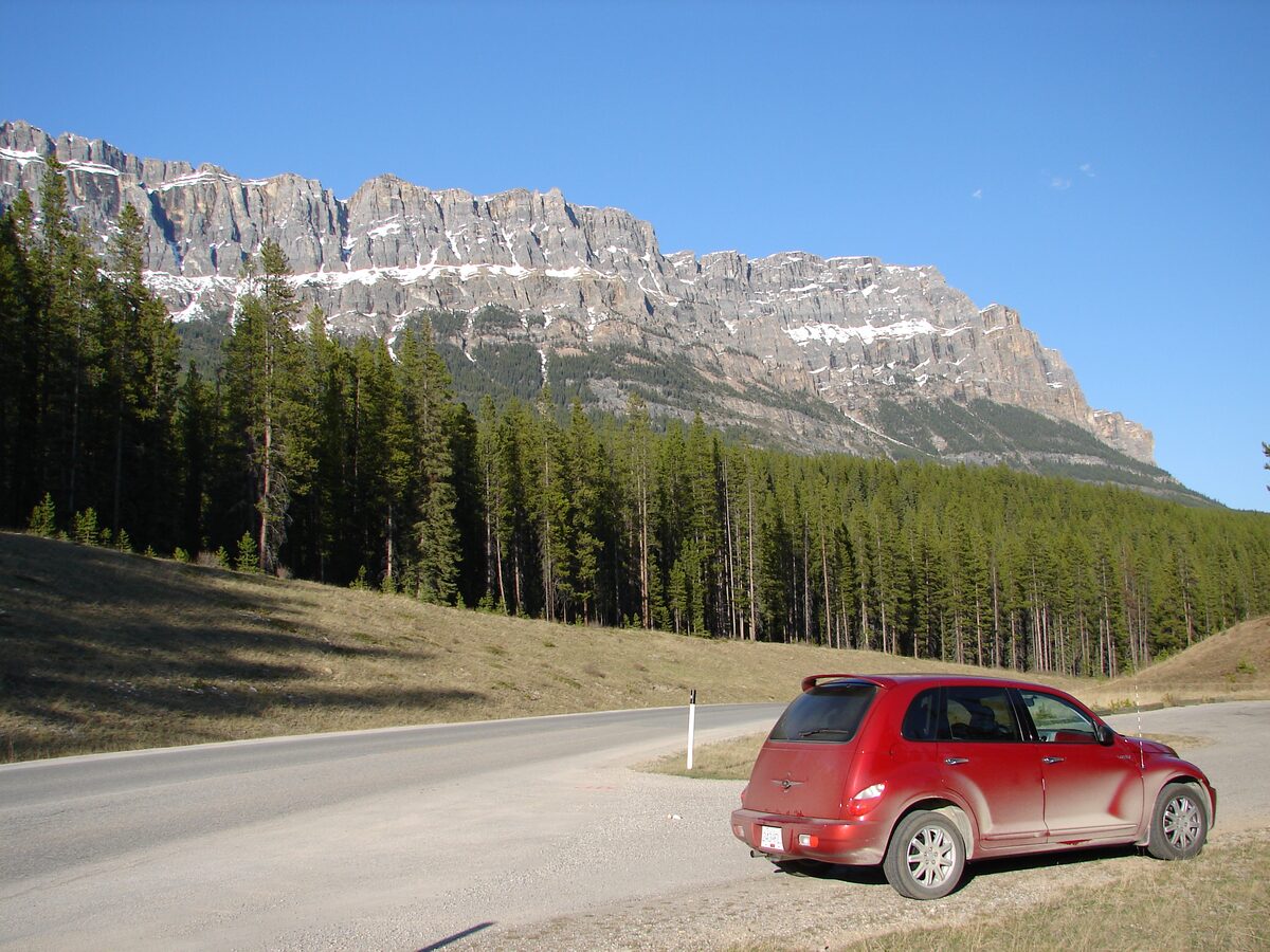 Castle Mountain's layered cliffs rising above the Bow Valley Parkway