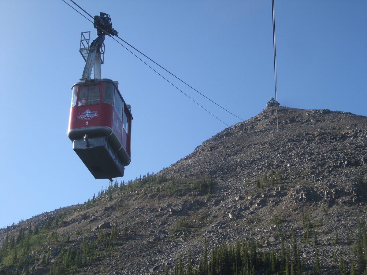 A red Jasper SkyTram cabin climbing the cable toward the Whistlers summit