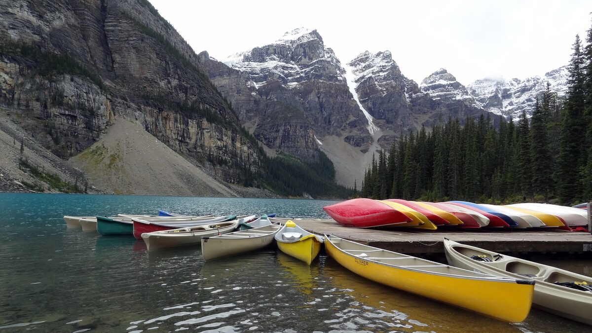 Colorful canoes lined up at the Moraine Lake canoe docks
