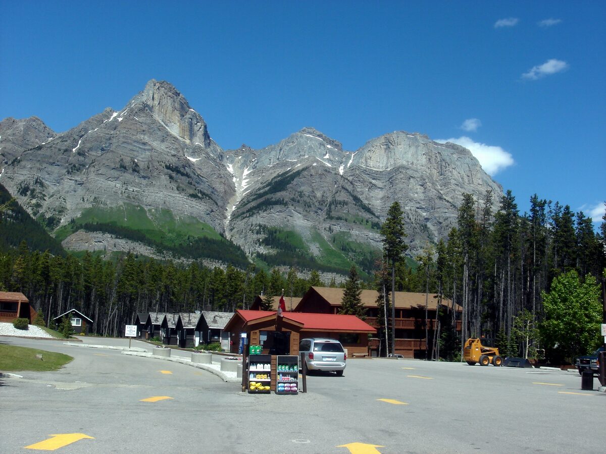 The Crossing resort's cabins and fuel stop below rocky peaks