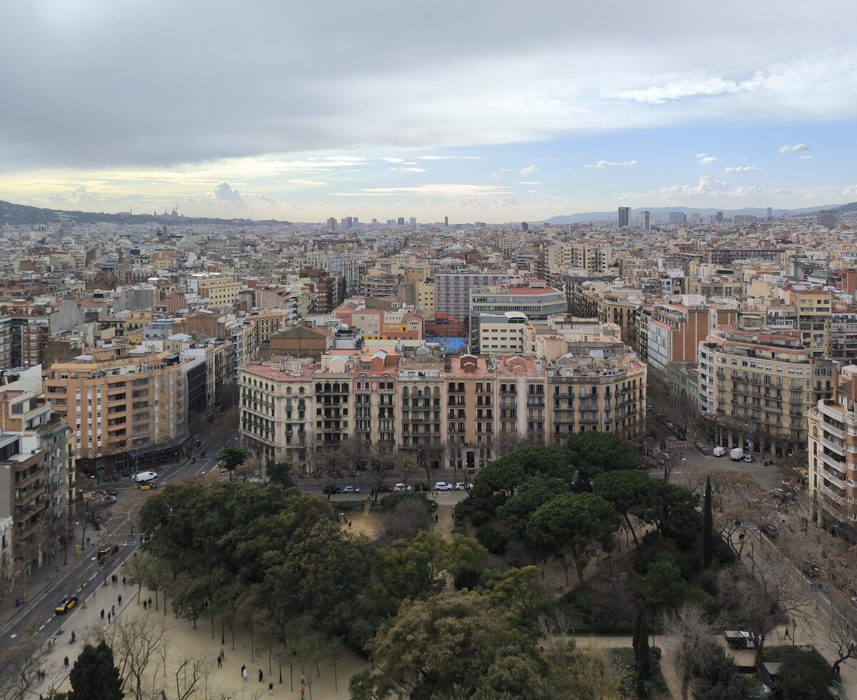 Barcelona's Eixample seen from the Sagrada Família tower, with trees on the square below
