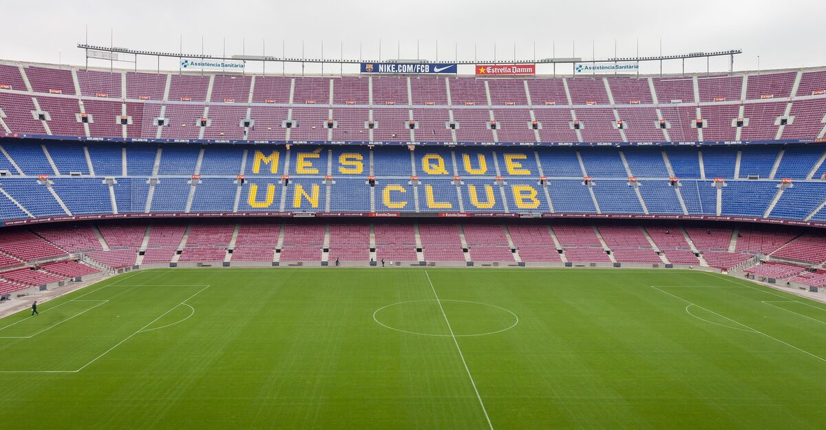 Camp Nou's stands with the words Més que un club across the seats