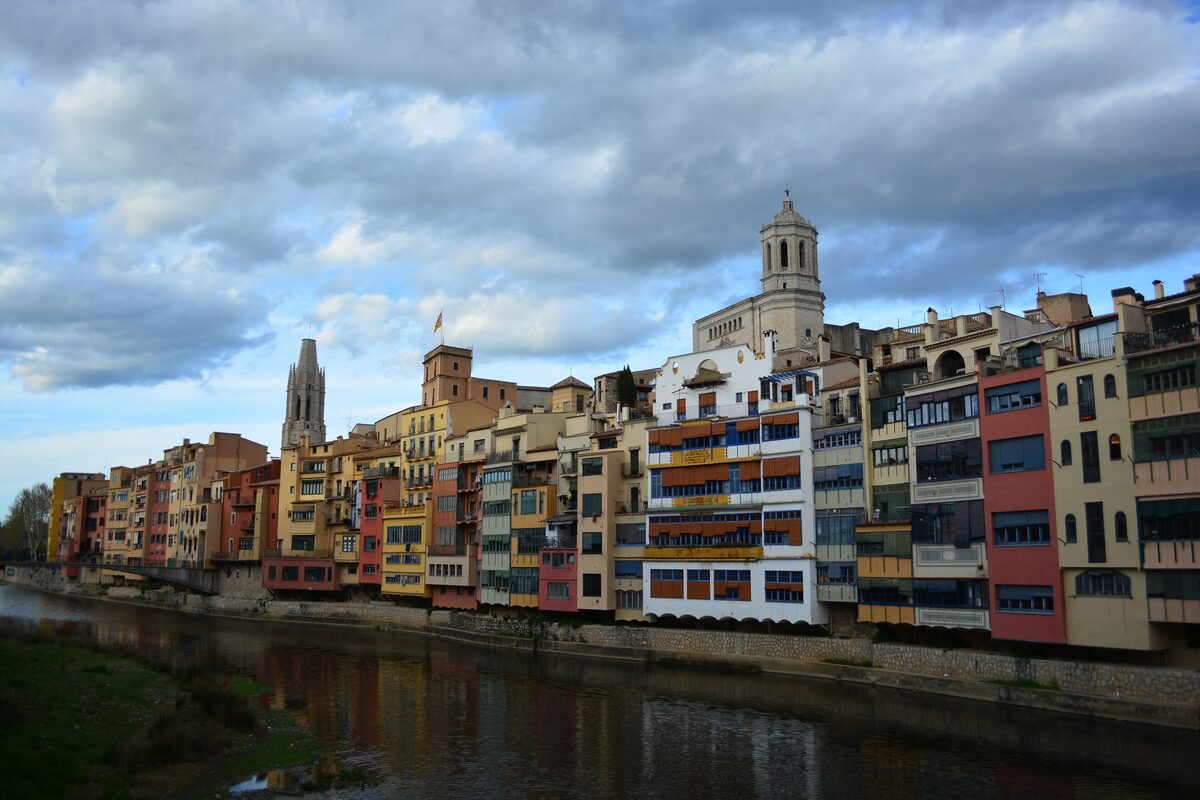 Girona's cathedral above the colored houses along the Onyar river