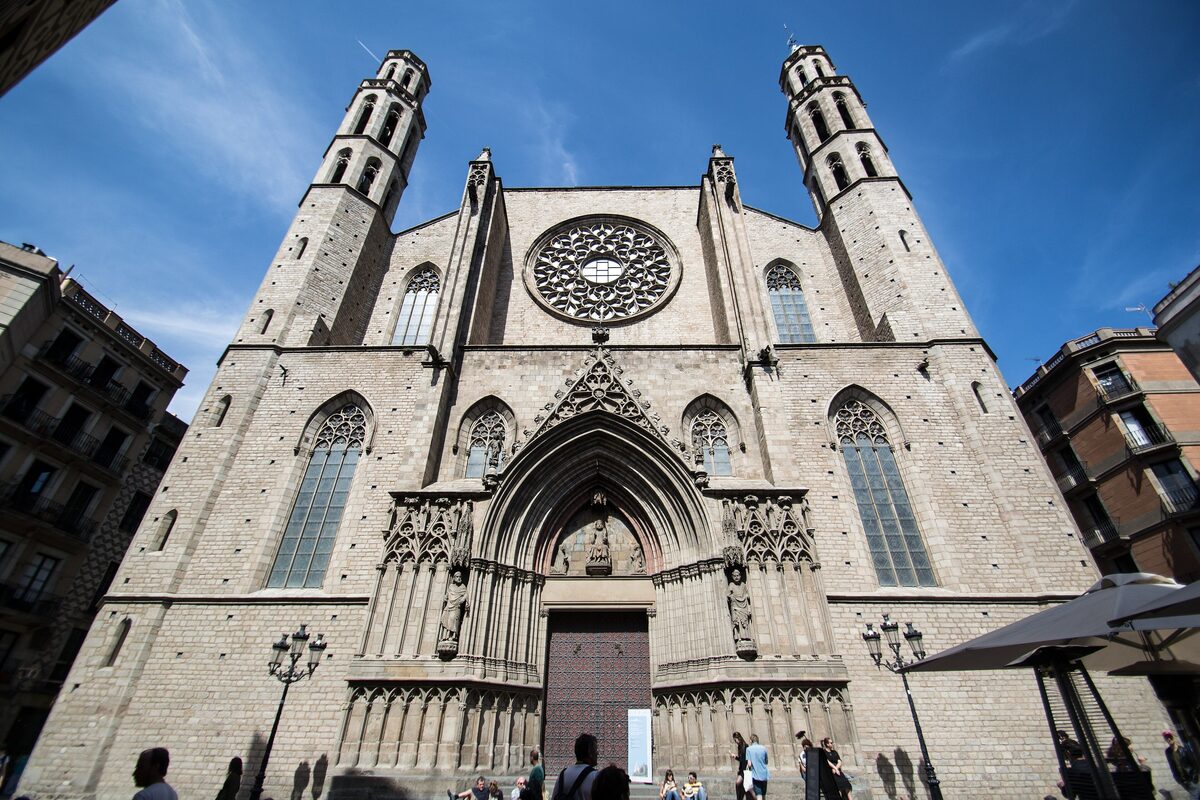 The plain Gothic facade of Santa Maria del Mar with its rose window and two octagonal towers