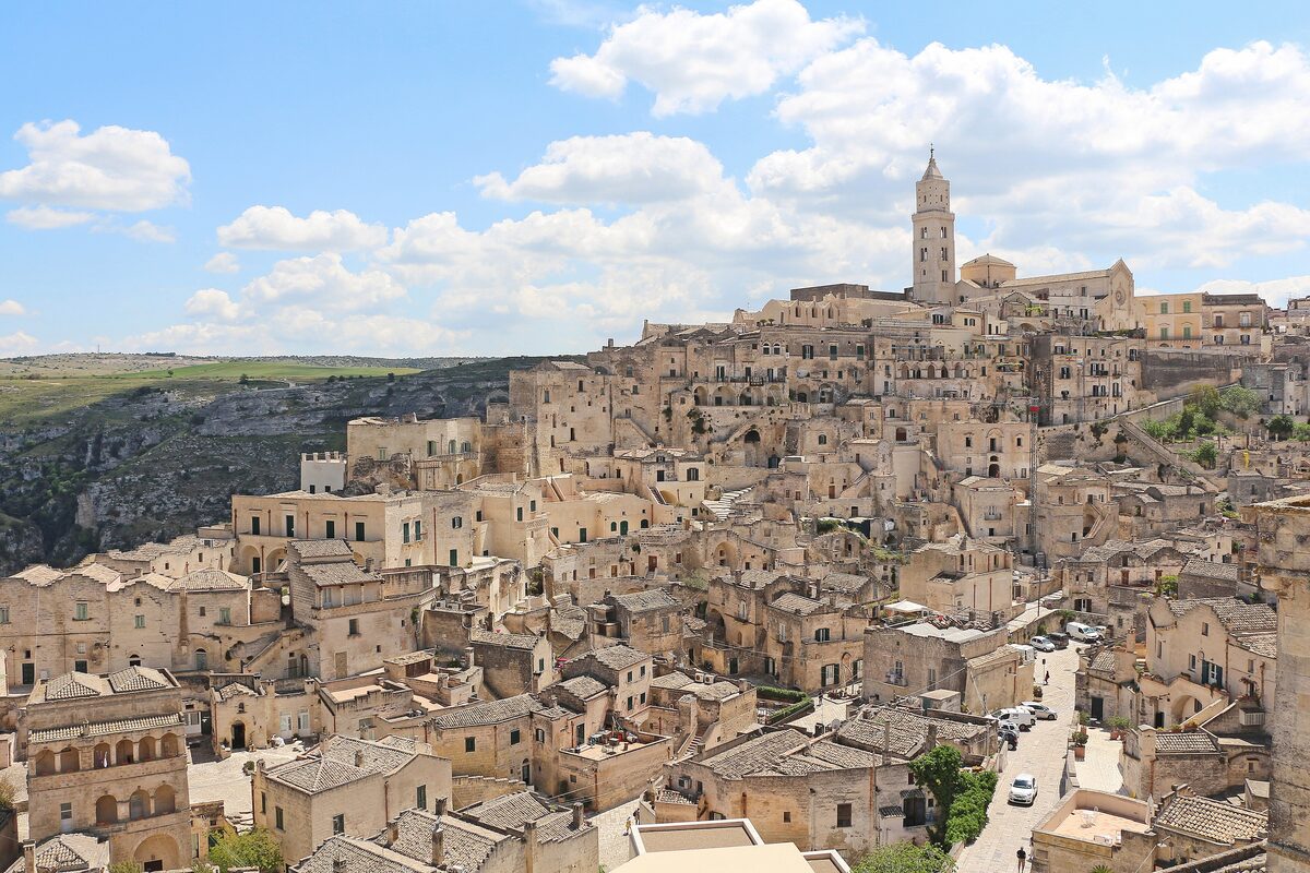 The stone houses of the Sasso Barisano stacked on the hillside, with the cathedral tower above