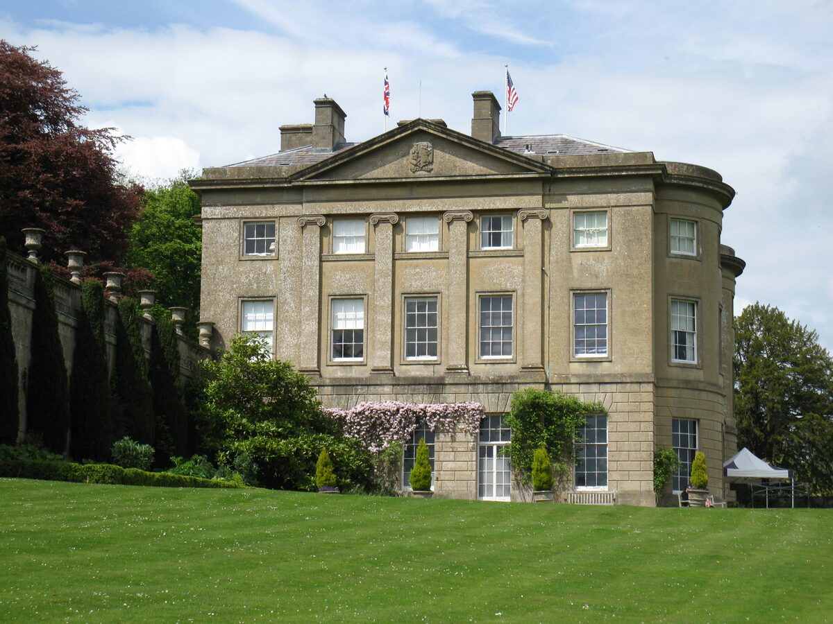Claverton Manor, the honey-colored stone house of the American Museum, above a lawn on a hillside outside Bath