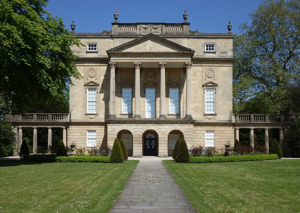 The Holburne Museum, a classical mansion with columns, at the end of a tree-lined avenue in Sydney Gardens