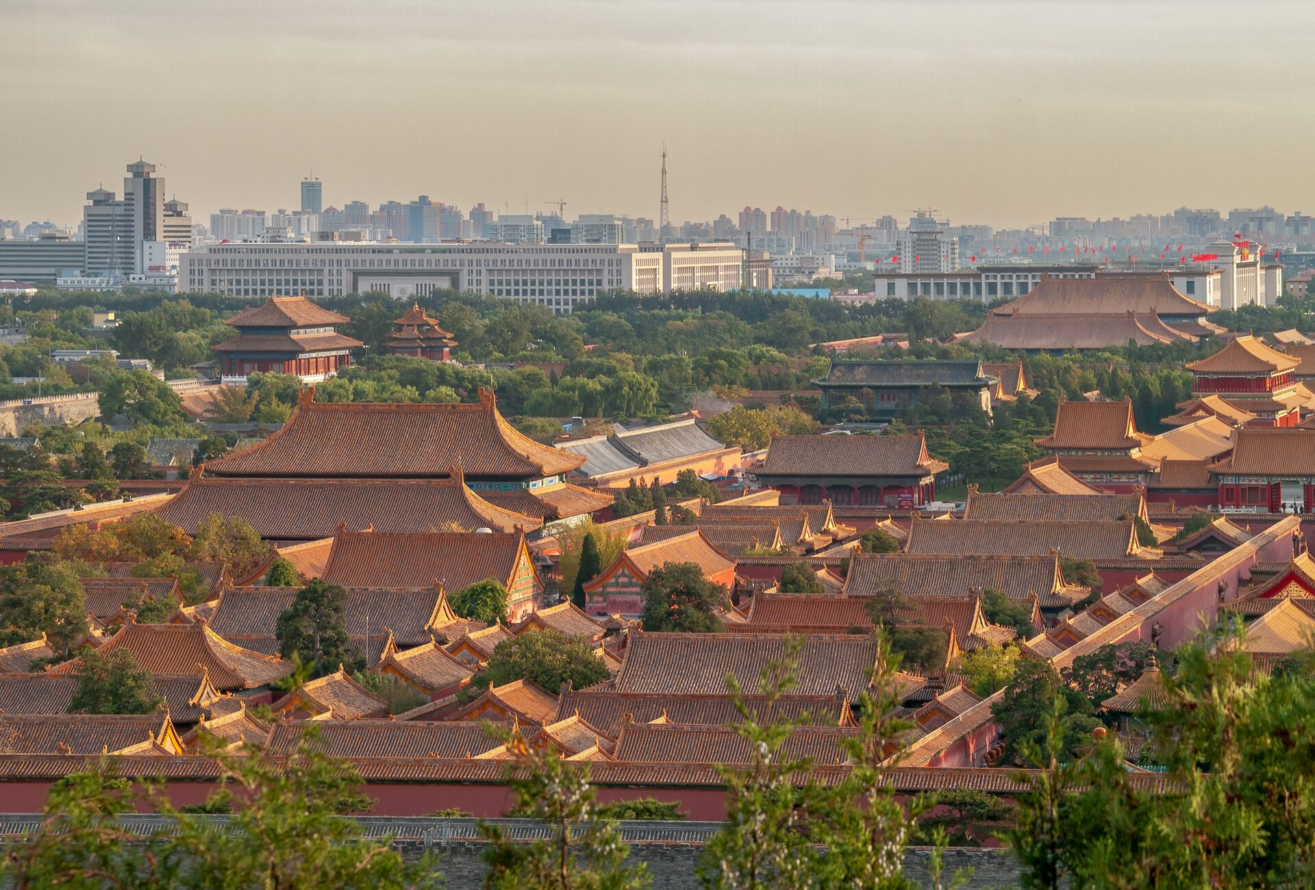 The golden roofs of the Forbidden City seen from Jingshan Park with the city beyond
