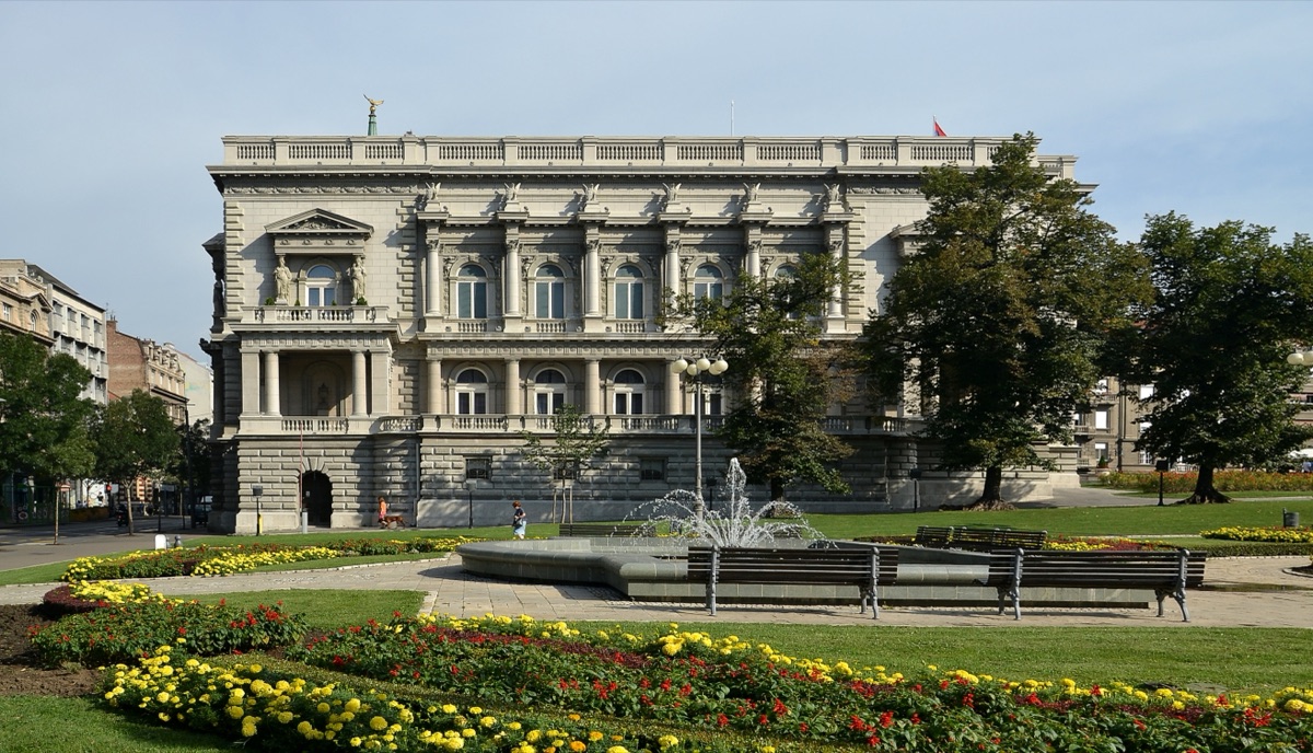 The Old Palace in Belgrade seen across Pionirski Park, with a fountain, benches and flower beds in front
