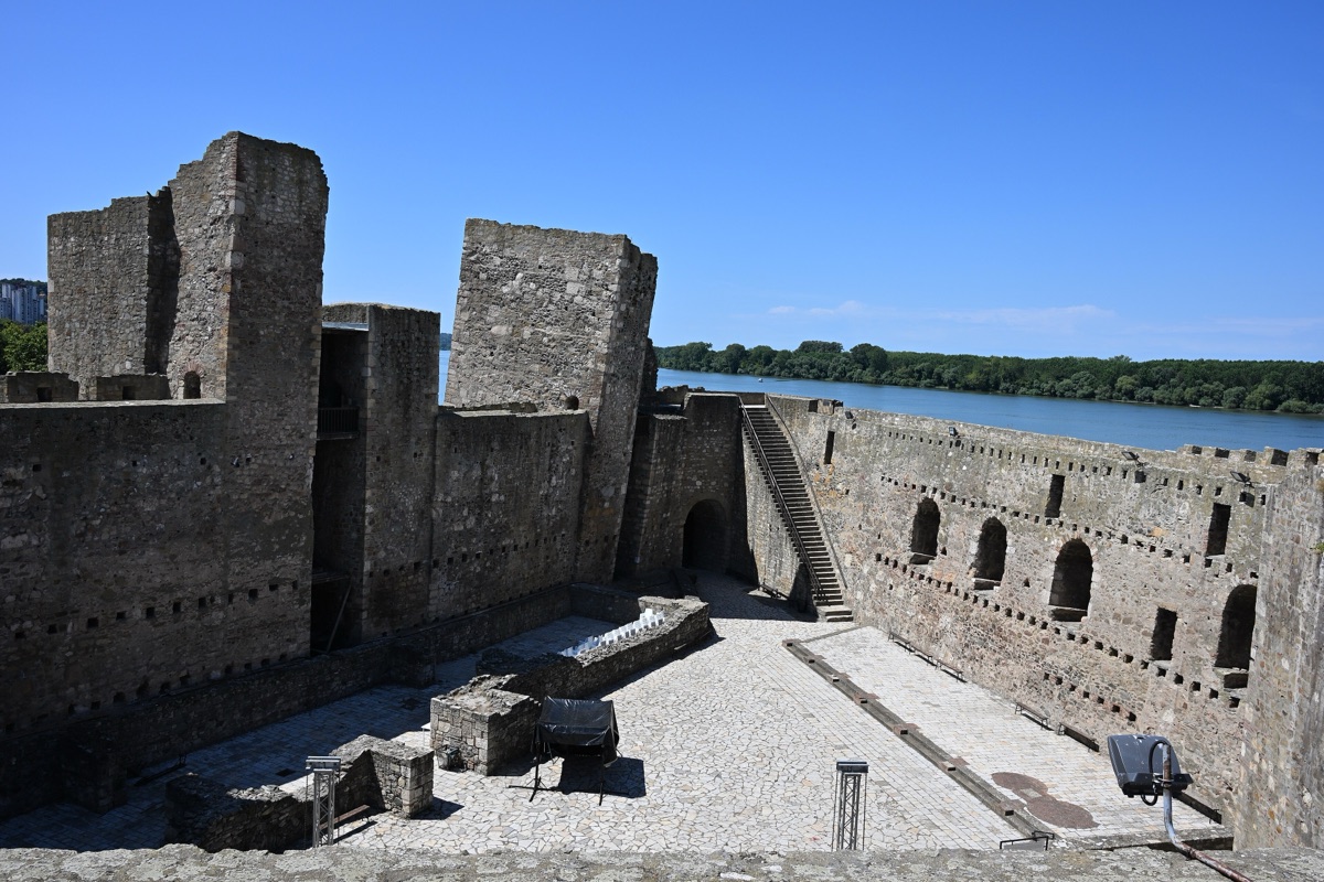 Inside Smederevo Fortress, with massive square towers and stone walls and the Danube beyond them