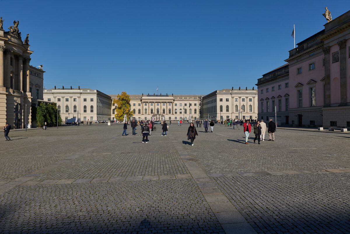 Bebelplatz on a sunny autumn day, a wide cobbled square with Humboldt University and the State Opera on either side