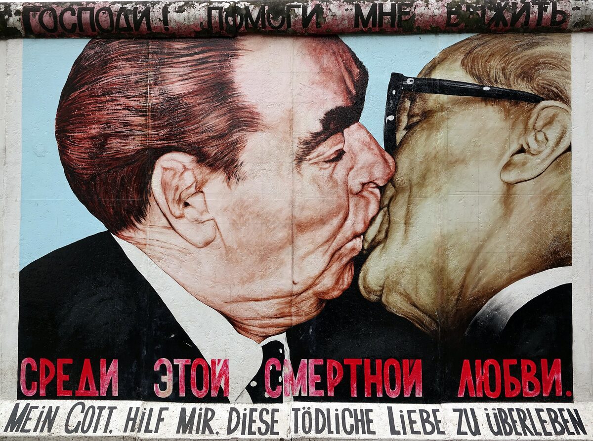The painting of Brezhnev and Honecker kissing on the East Side Gallery, with its caption in Russian and German