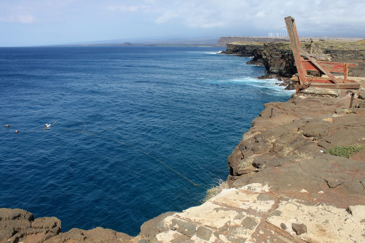 Dark sea cliffs and deep blue water at South Point