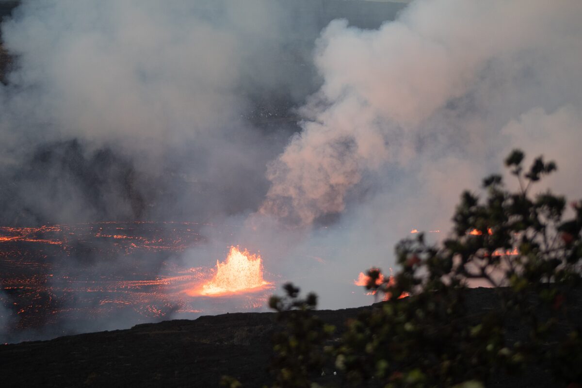 Orange lava fountain in the smoking Halemaʻumaʻu crater