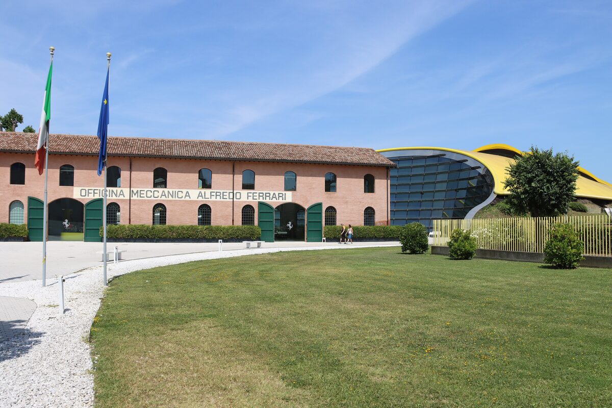 The brick Officina Meccanica building of the Enzo Ferrari museum, with its curved modern wing beside it