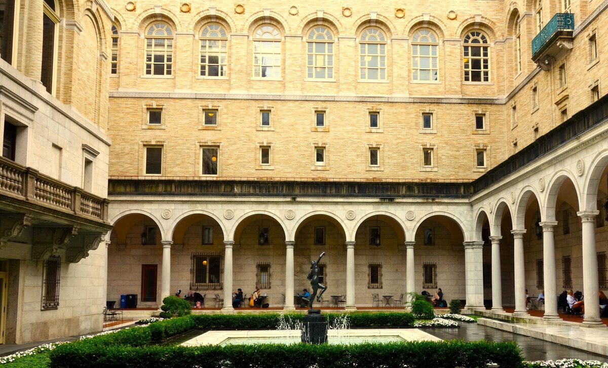 The arched courtyard and garden fountain of the Boston Public Library
