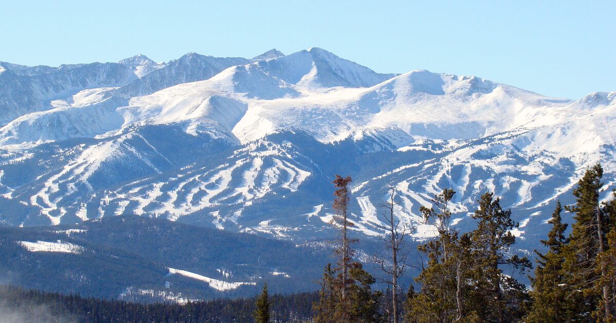 The Tenmile Range above Breckenridge in winter sun, with the ski runs of Peaks 7 to 10 cut into the snowy slopes