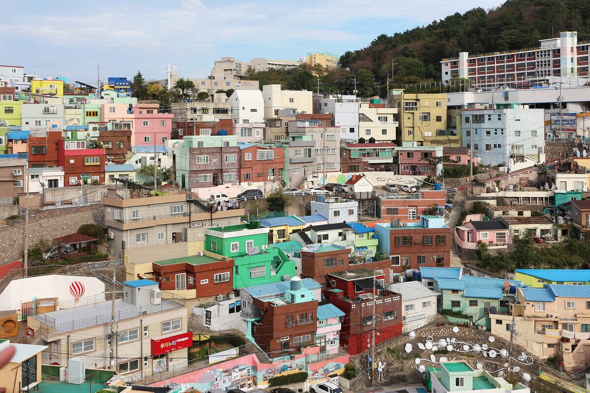 Hillside houses in Gamcheon painted in blue, green, pink and yellow, stacked up the slope