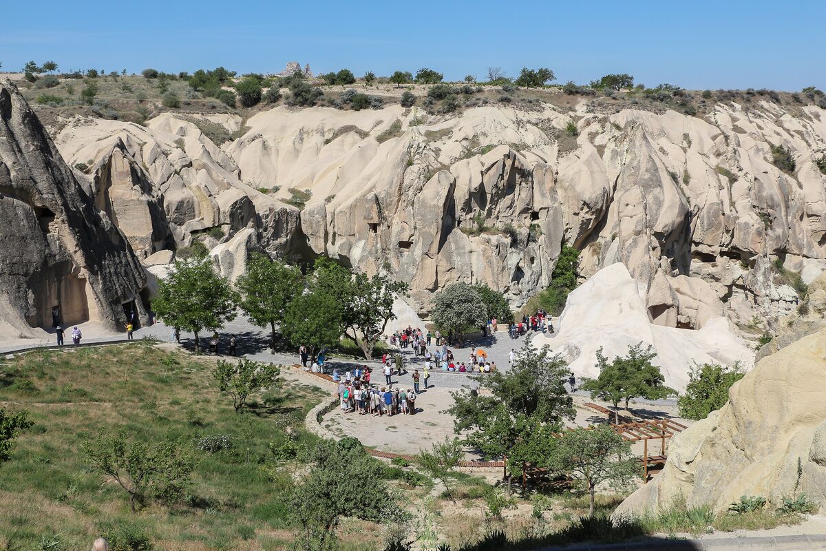 The Göreme Open-Air Museum from above: cream rock cones carved with chapels around a tree-lined square