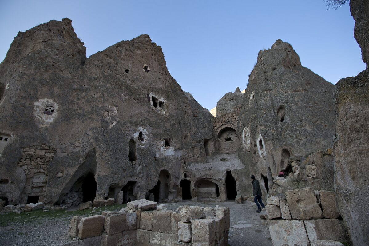 Grey tuff cones carved with church and cave-house openings in the Soğanlı Valley
