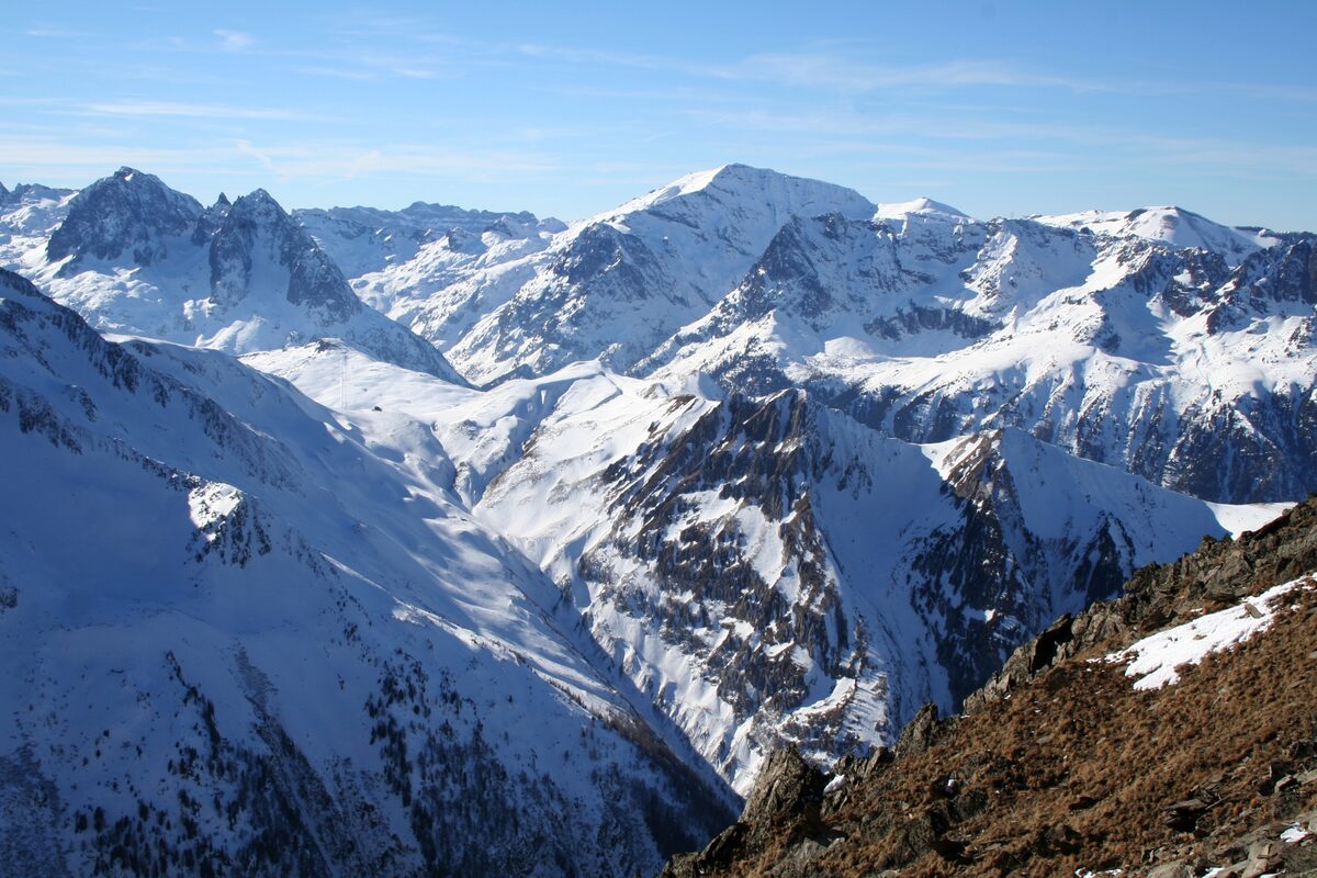 Snowy ridges and peaks of the Aiguilles Rouges and the Buet, seen from above the Col de Balme