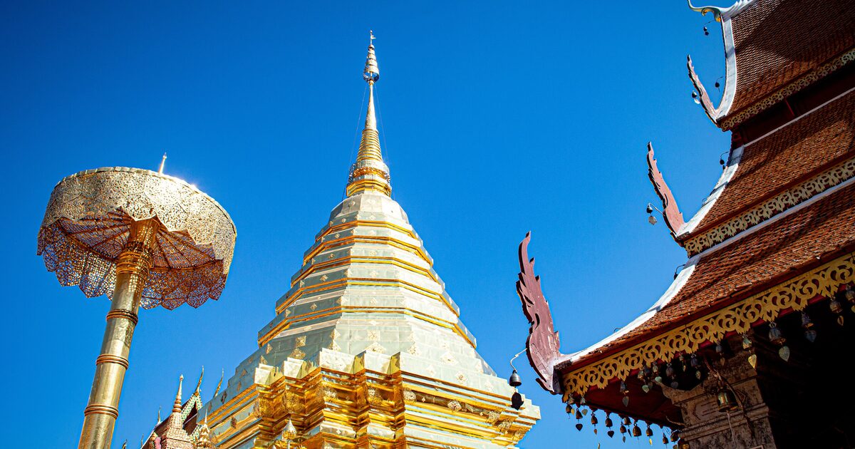 The gilded chedi of Wat Phra That Doi Suthep under a clear blue sky