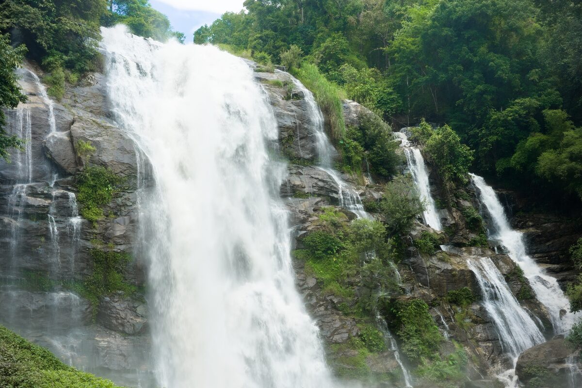 Wachirathan Falls, a tall waterfall pouring over a green cliff in Doi Inthanon National Park