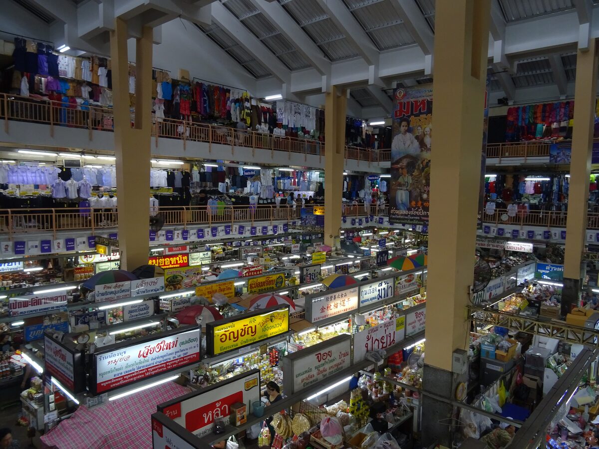 Inside Warorot Market, with stalls on two levels under a high concrete roof