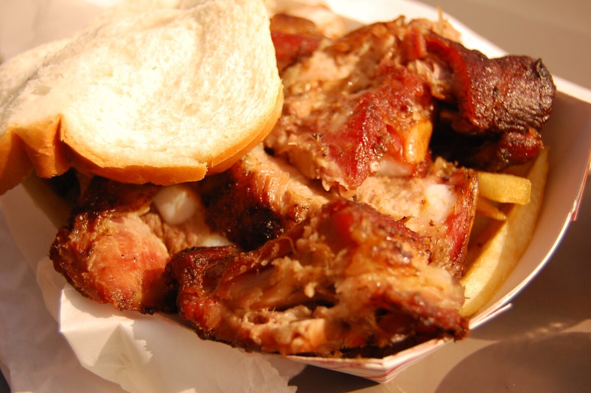 Rib tips and a slice of white bread in a paper tray