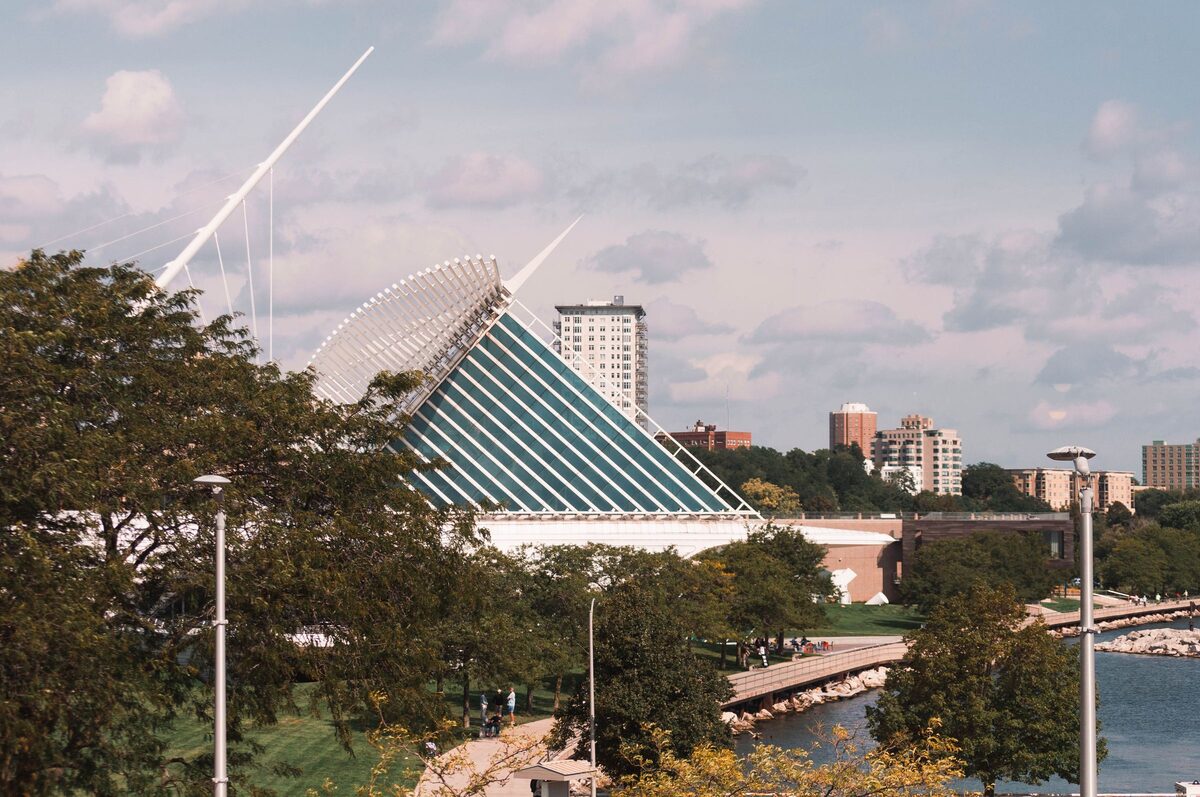 The glass and white-steel Quadracci Pavilion of the Milwaukee Art Museum seen over trees on the lakefront