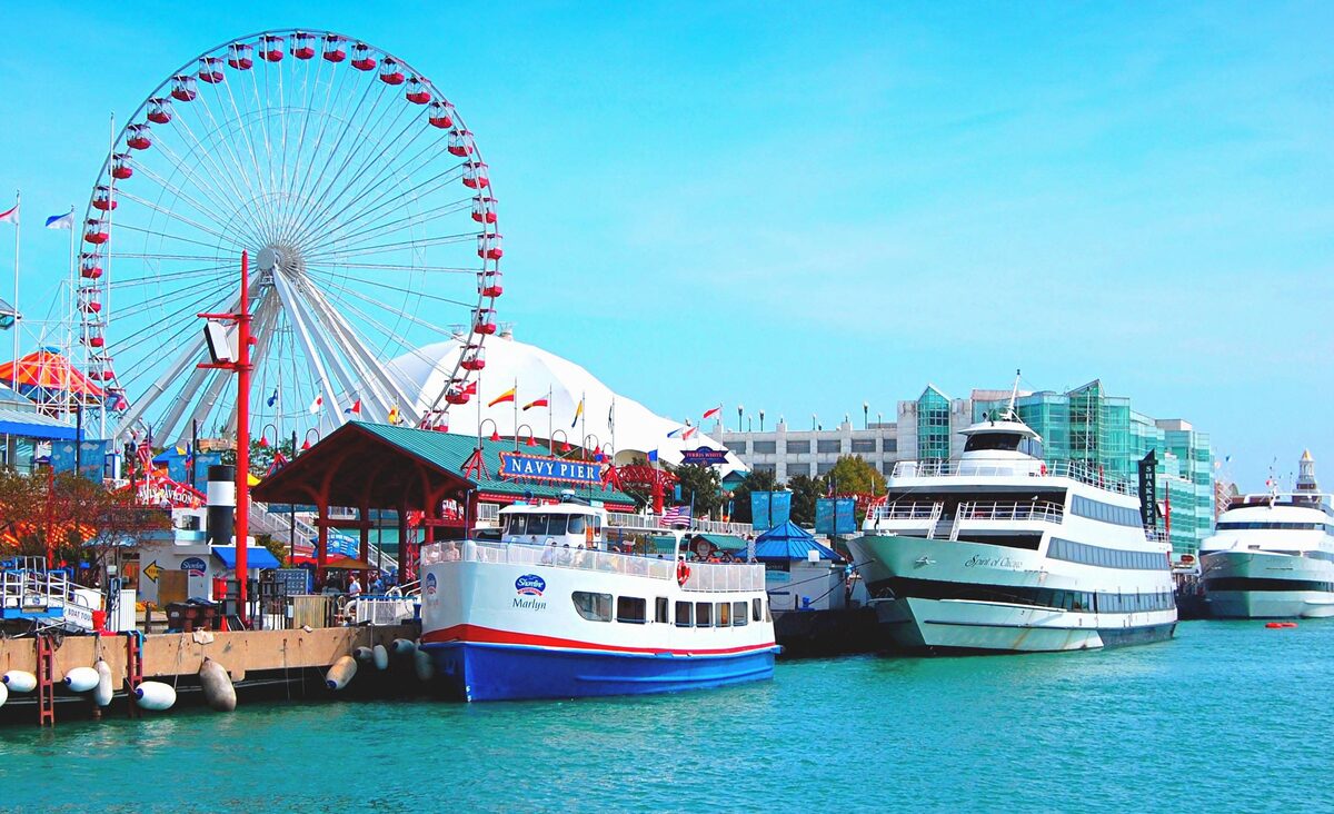 The Ferris wheel and tour boats at Navy Pier on a clear day