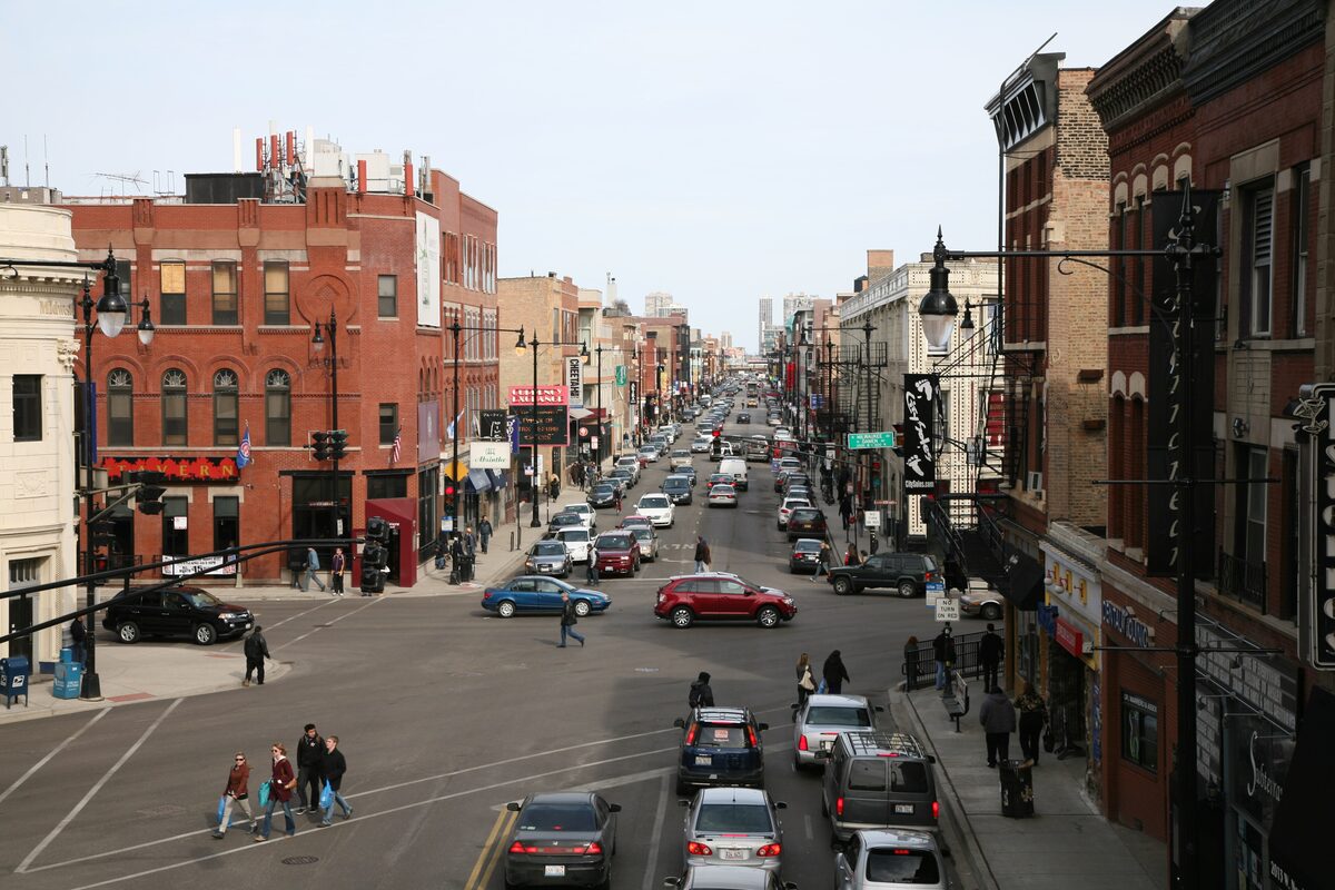 North Avenue in Wicker Park seen from the Damen 'L' platform, with brick storefronts on both sides