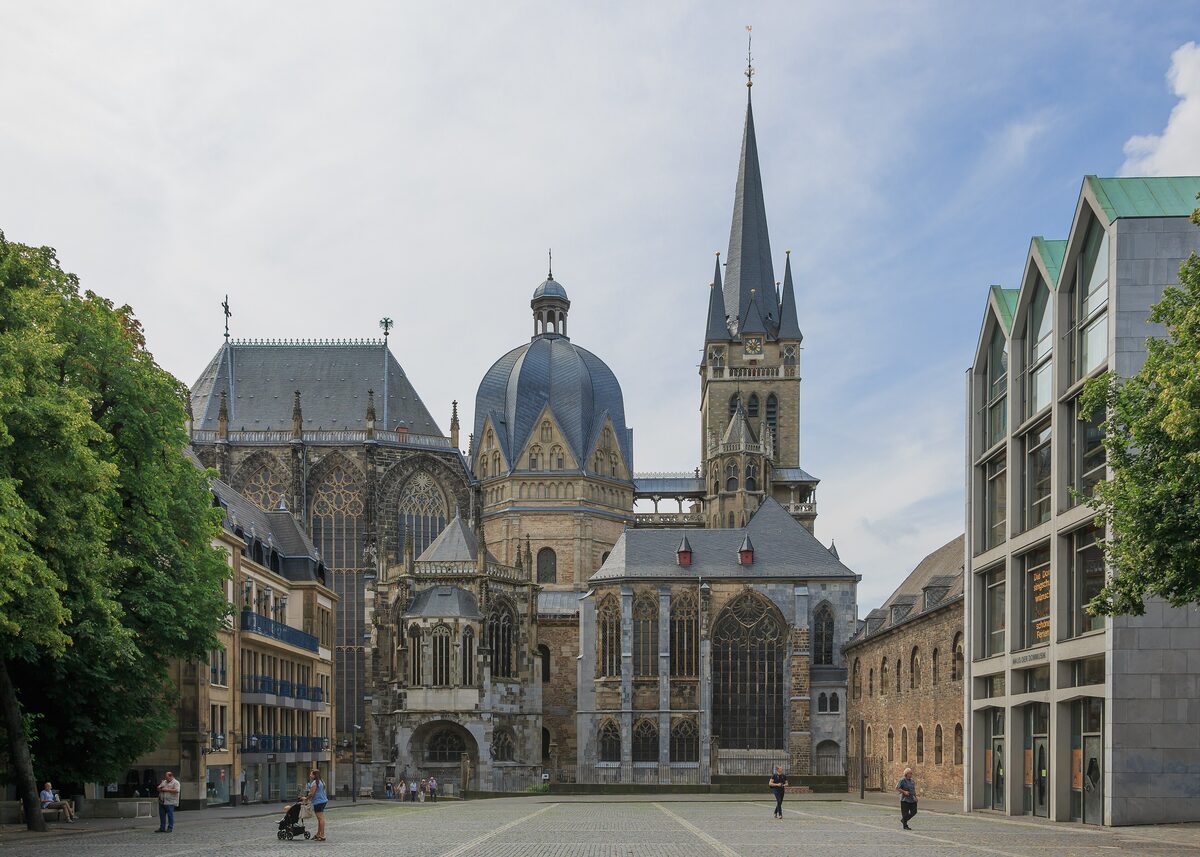 The domed Palatine Chapel and Gothic choir of Aachen Cathedral above the square in front