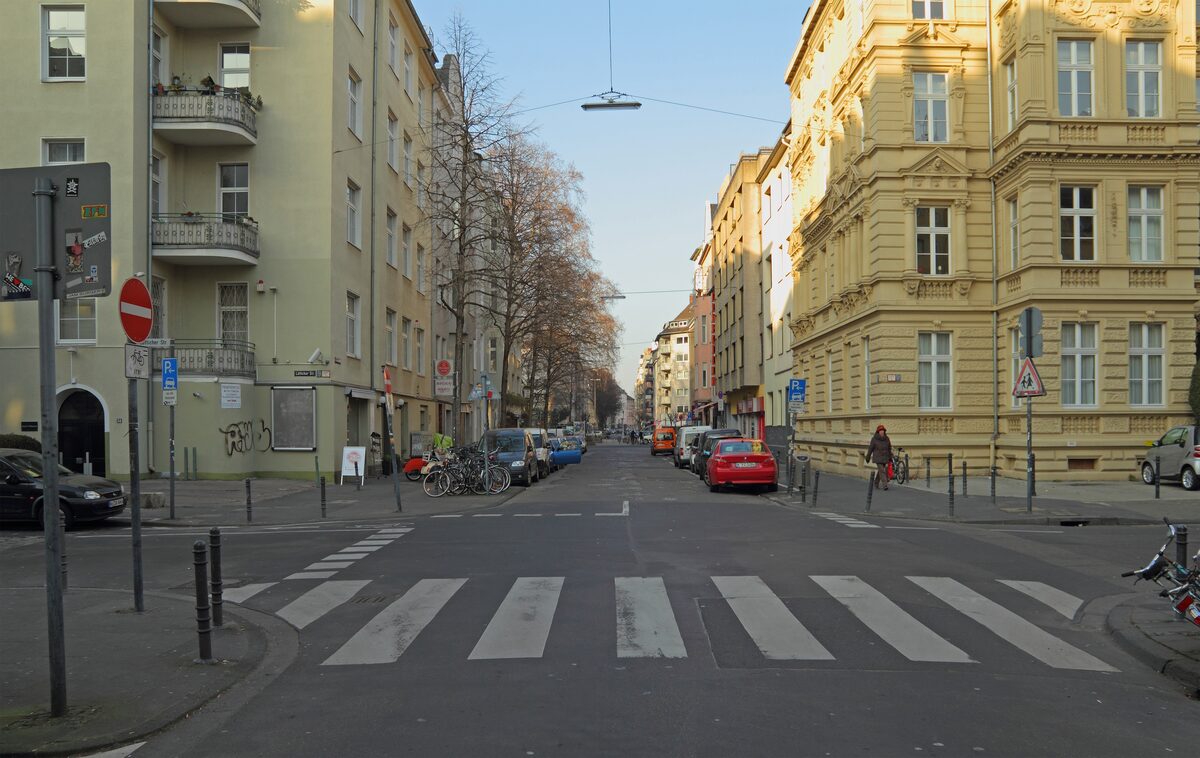 A street in the Belgian Quarter lined with 19th-century apartment buildings and trees