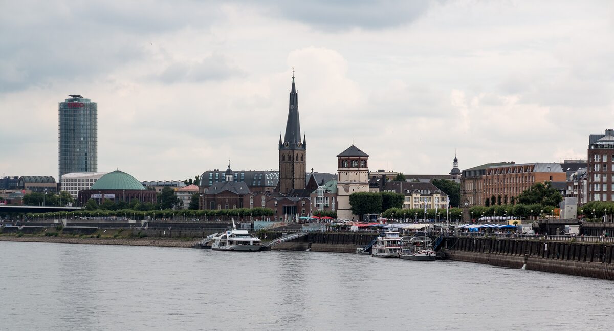 The Düsseldorf waterfront across the Rhine, with the church tower of the old town and the Rhine promenade