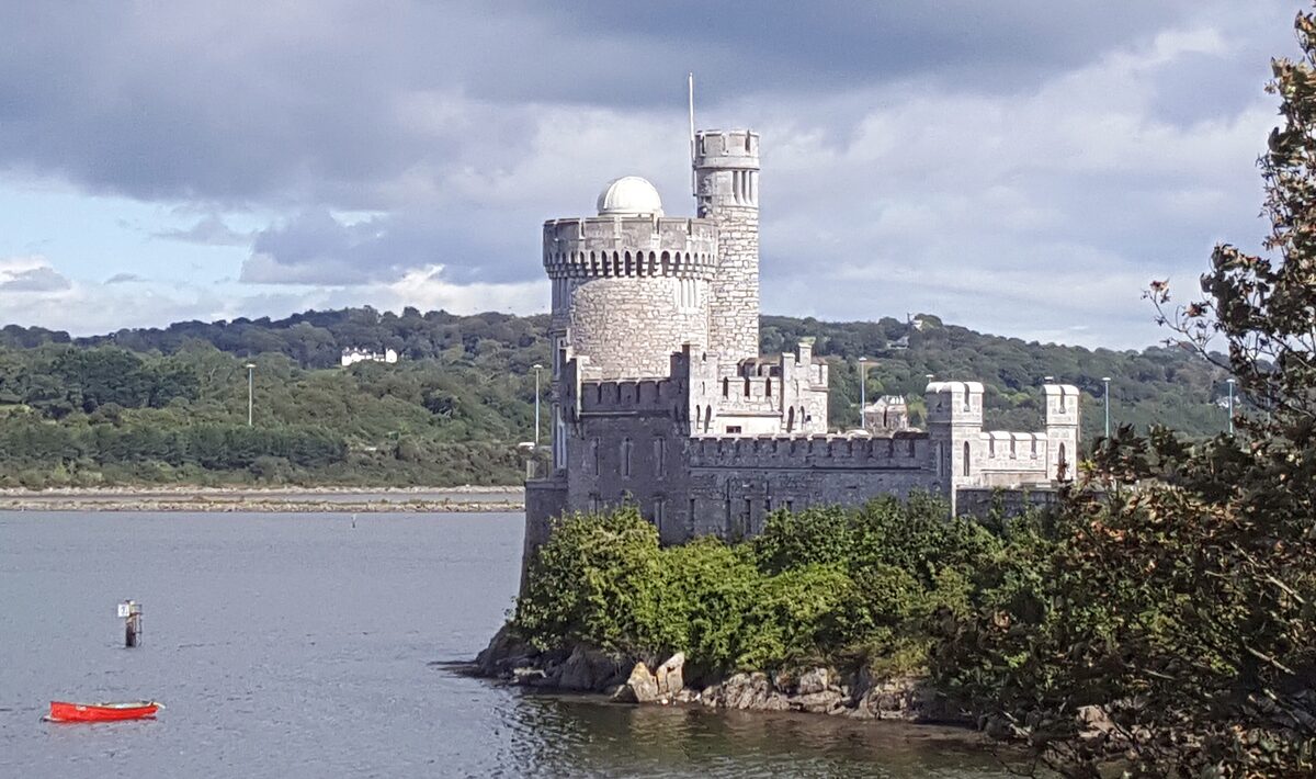 Blackrock Castle on its rock at the edge of the River Lee, with a round tower and the white dome of the observatory