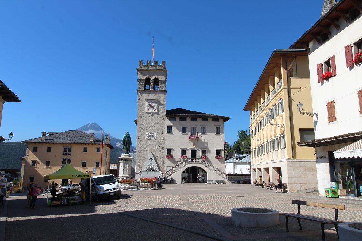 The Palazzo della Magnifica Comunità on the square in Pieve di Cadore, with its clock tower and arched entrance