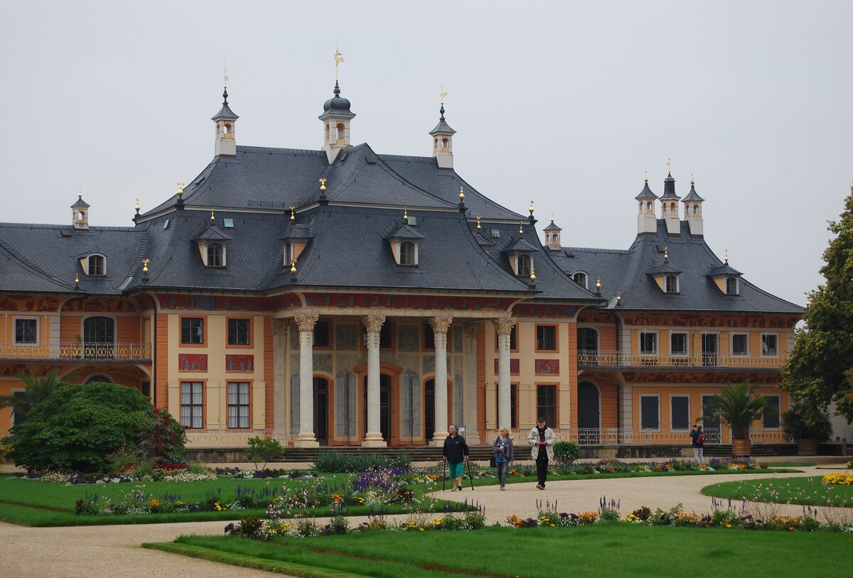 The Bergpalais of Pillnitz Palace with its black Chinese-style roof, set behind flower beds