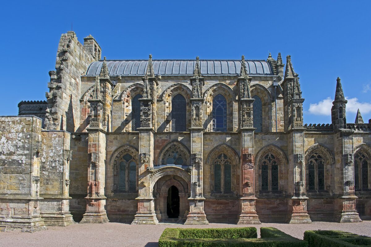 Rosslyn Chapel, a small Gothic chapel with pinnacles and carved stone walls, seen from the south