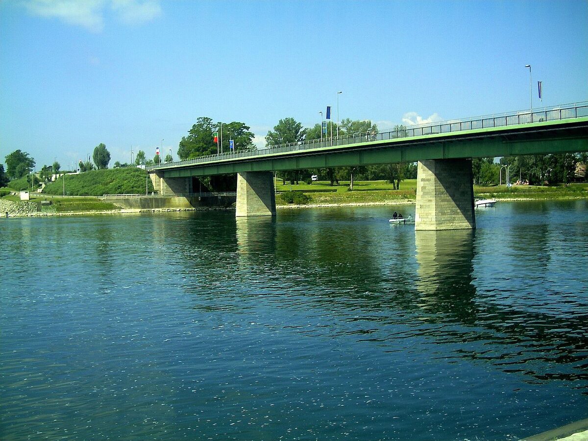 The road bridge over the Rhine at Breisach, with the wide green river in the foreground