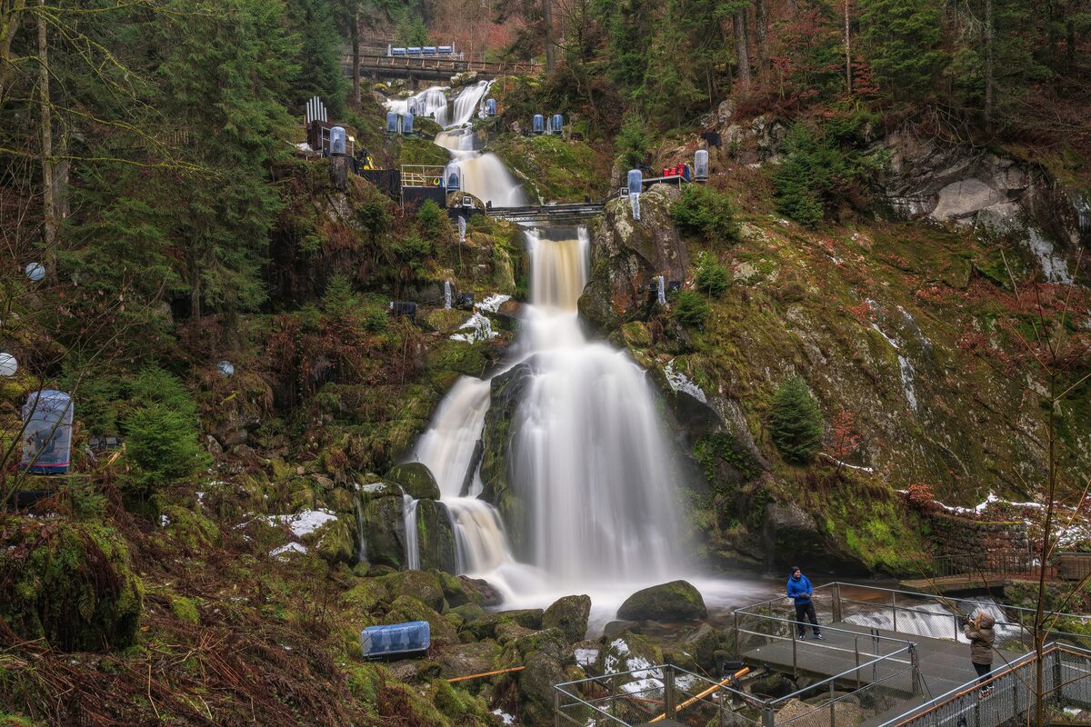 The Triberg waterfalls tumbling down a wooded slope, with viewing platforms alongside