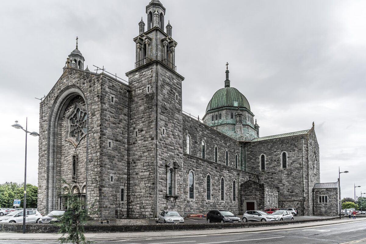 Galway Cathedral, a large gray limestone church with a green copper dome and a tower above the main entrance