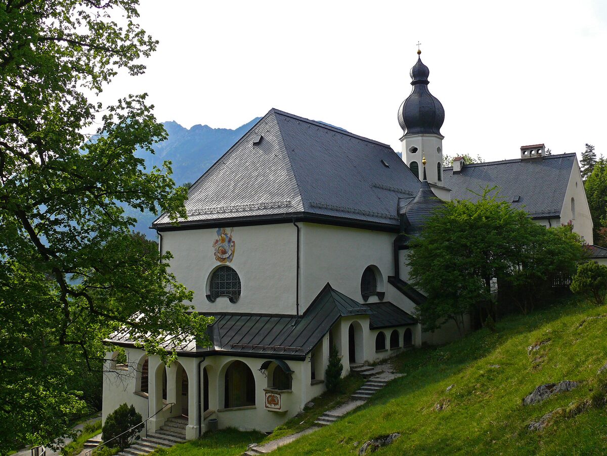 The pilgrimage church of St. Anton above Partenkirchen, with its tower rising among the trees